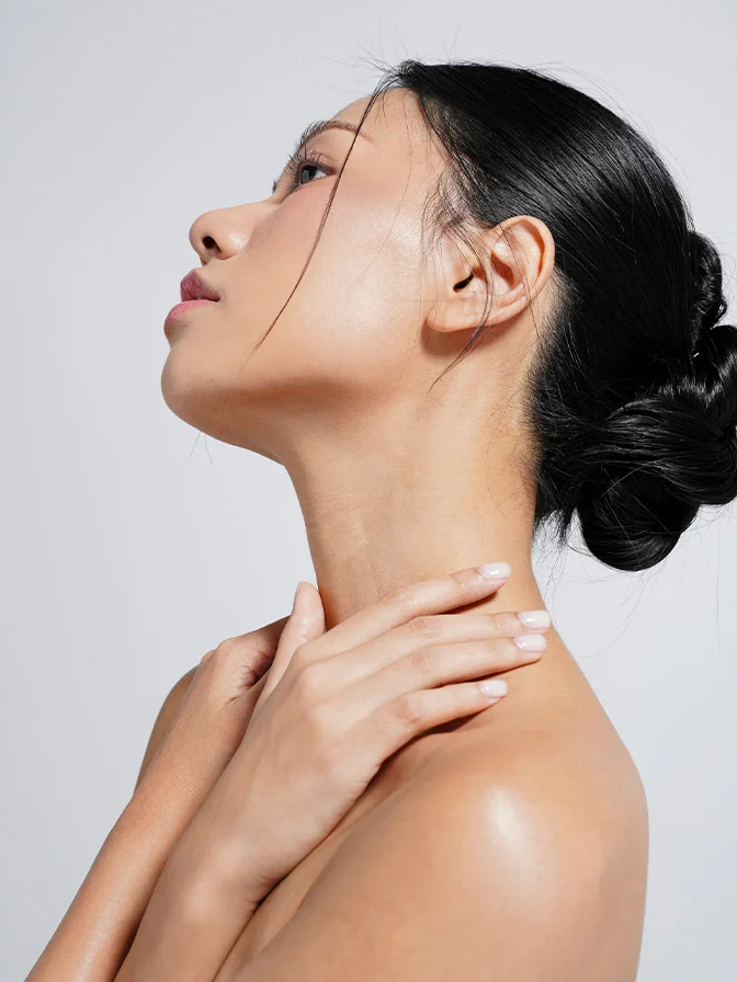 Woman with smooth skin touching neck and shoulder, demonstrating skincare and beauty routine with head tilted back - Morpheus8 in Tampa, FL